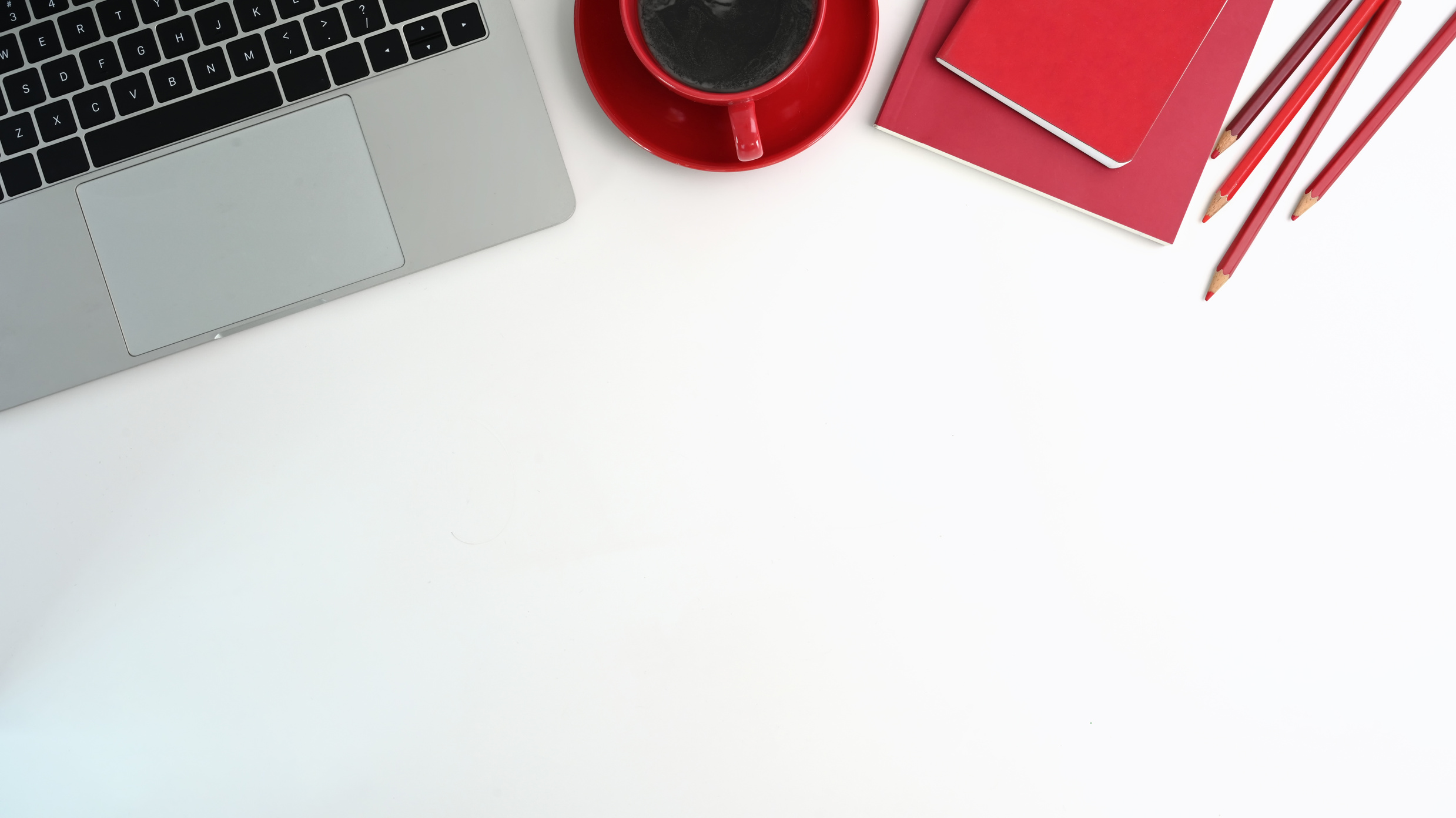 Top View Office Desk with Laptop Computer, Red Cup Coffee, Red N